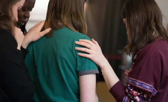 Friends consoling a woman for Bereavement/Grief & Loss counselling